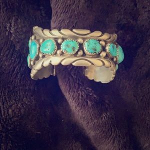A beautiful bracelet with turquoise stones.